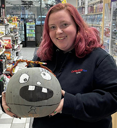 Team member with halloween decoration