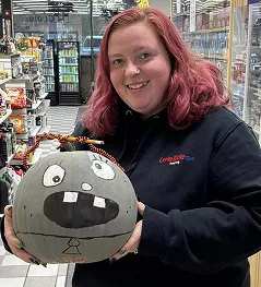Team member with halloween decoration